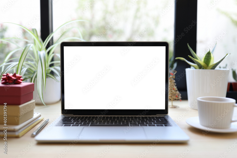 Laptop with white coffee cup and gift box
Laptop with white coffee cup and gift box