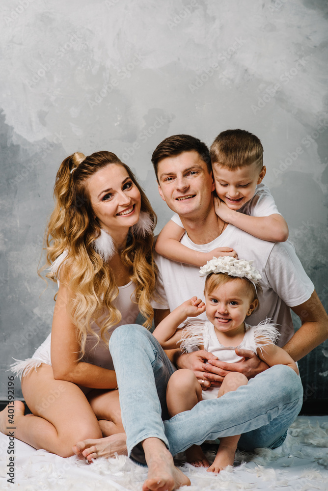 Happy family portrait in casual style clothes. Nice family wearing