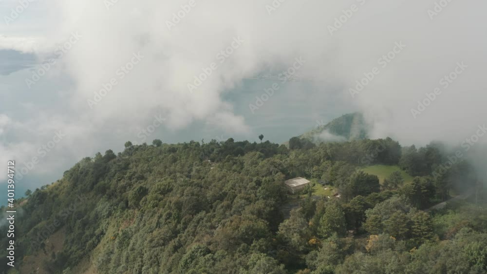 Drone aerial view of a forest in the mountains, high over the clouds in Lake Atitlan Guatemala Drone aerial view of a forest in the mountains, high over the clouds in Lake Atitlan Guatemala