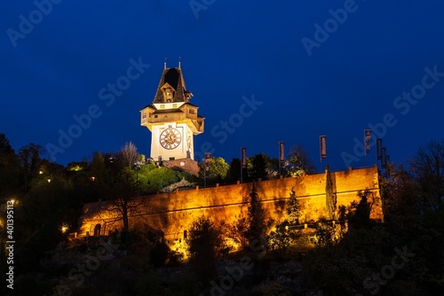 Tablou pe pânză The Schlossberg or Castle Hill with the tower Uhrturm at night, Graz, Austria