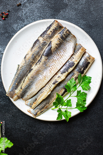 whole herring fresh fish or salted seafood ready to cook and eat on the table pescetarian diet for healthy meal snack outdoor top view copy space for text food background rustic image 