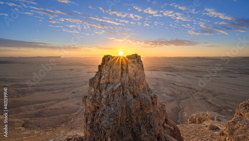 Beautiful sunrise landscape with sunburst over Machtesh Ramon (Ramon Crater), Negev Desert, Israel photo