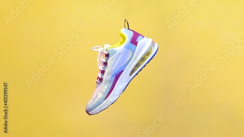 Spinning sports shoe concept, white shoes with a blend of colorful lines. Sport shoe rotation isolated on yellow background. Blue and red lighting from the side of the shoe. illustration of sport shoe
