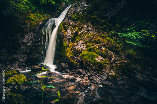 Waterfall in nature. Nice long exposure of a waterfall  a river cascading down a rock.