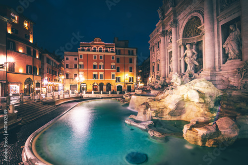 Trevi Fountain in Rome and surrounding streets in the morning and people empty. Beautiful lighting in the Eternal Stardt in Italy