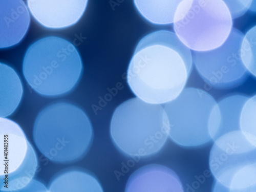 purple background with multicolor light effects. Horizontal background with blur bokeh effects for christmas time