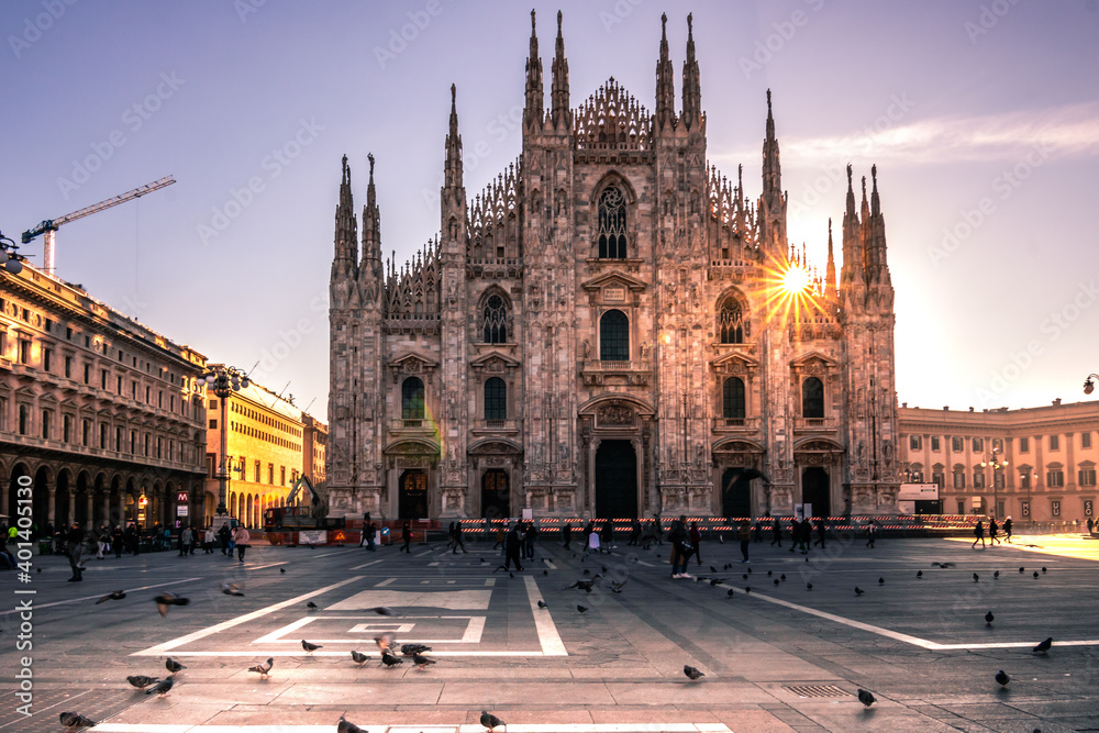 Cathedral in milan with pigeons in the morning