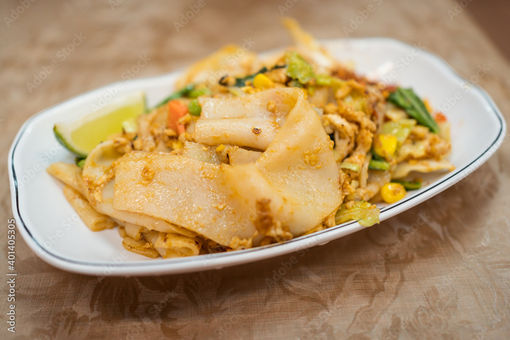 Detail shot of Asian food dish of fried noodles