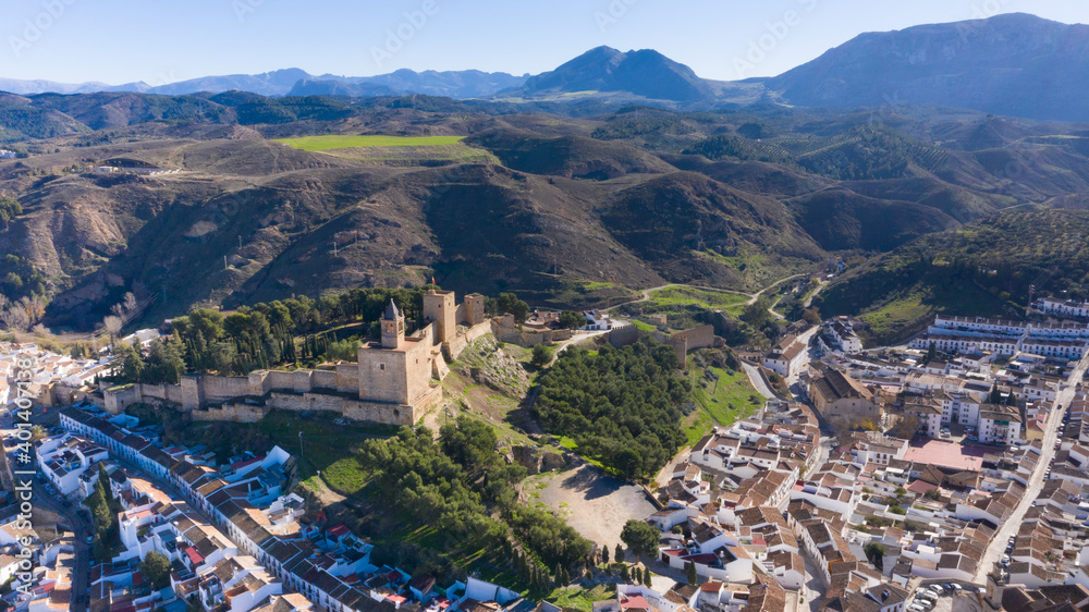 Aerial drone views of the Alcazar castle of Antequera on top of a hill in the Andalusian countryside
