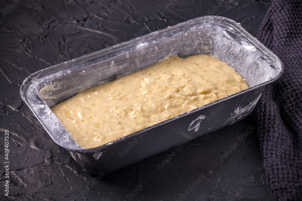 The process of making a traditional American dish of gluten-free and dairy-free banana bread on a black concrete background. Top view, copy space. The process of making a traditional American dish of gluten-free and dairy-free banana bread on a black concrete background. Top view, copy space.