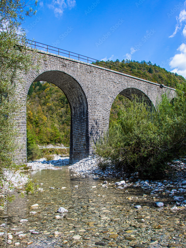 Fototapeta premium Bridge-viaduct over the rocky river Idrija