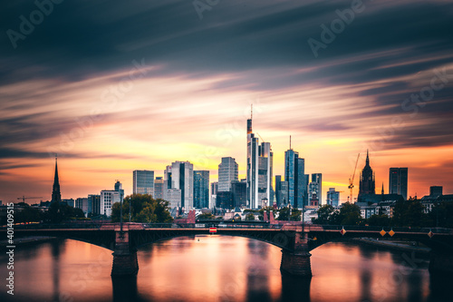 What a mood in the sky  sunset with incredible clouds and colors with a view over the Main. The Frankfurt skyline can be seen in the background. Shipping romance on the river in Germany