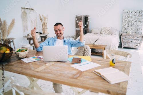 Young man satisfied with results of work