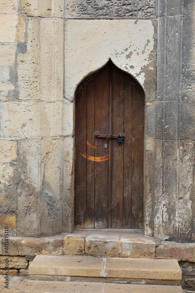Photo of a brown wooden door on the right