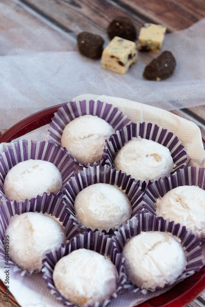 Greek Christmas cookies kourabiedes with almonds powered with white sugar Greek Christmas cookies kourabiedes with almonds powered with white sugar
