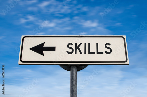 Skills road sign, arrow on blue sky background. One way blank road sign with copy space. Arrow on a pole pointing in one direction.