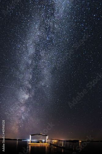 Milky Way in Germany in a beautiful landscape with buildings. stars, moon and sky at night. astronomy.