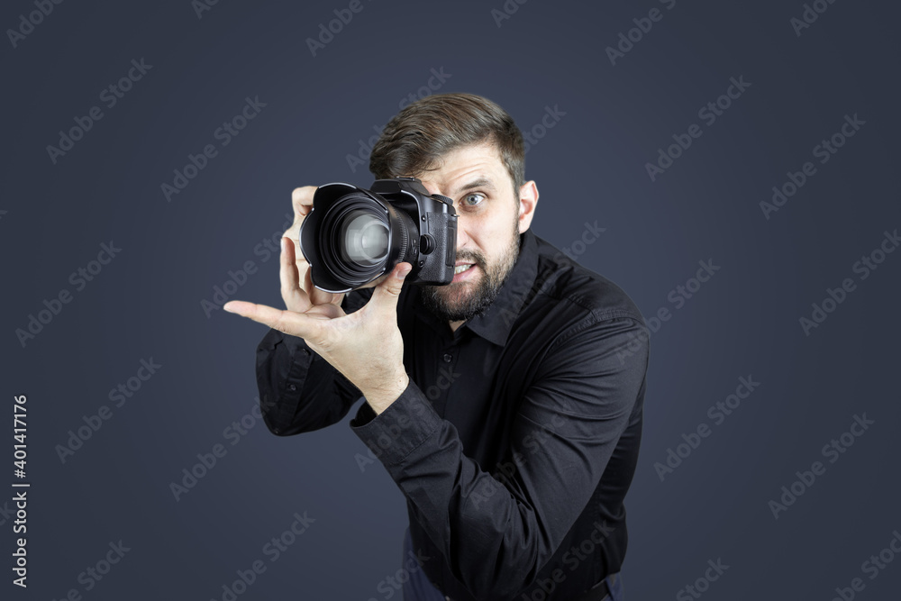 a man with a camera in his hands takes a picture a man with a camera in his hands takes a picture