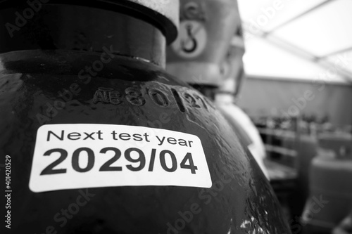 Black gas cylinders with best before date on label