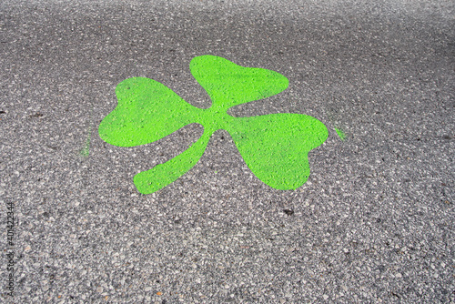 Saint Louis, MO—Mar 15, 2019; green shamrock temporarily painted on road to mark Saint Patrick’s day parade route and 5K race downtown photo