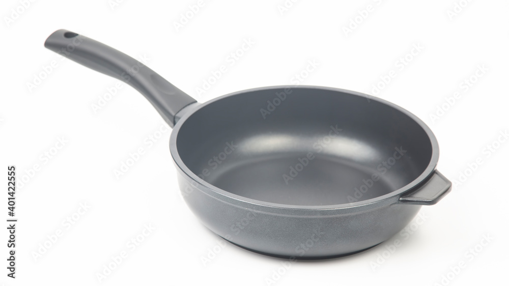 Black frying pan with non-stick teflon coating on white background Black frying pan with non-stick teflon coating on white background