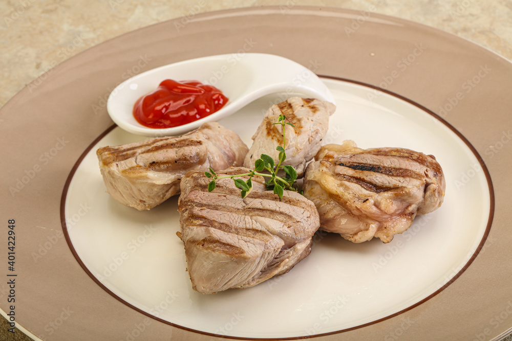 Grilled pork tenderlion with tomato sauce