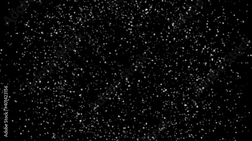 Falling snowflakes close up on isolated black background in space.