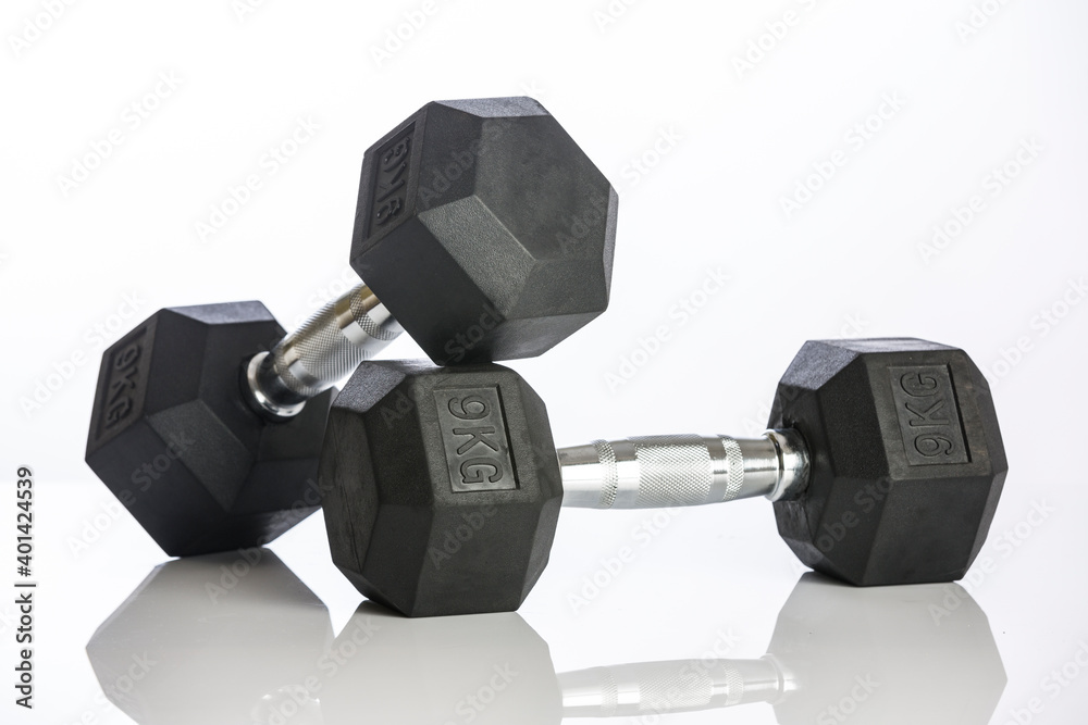 Dumbbell on white background, Studio shot. Dumbbell on white background, Studio shot.