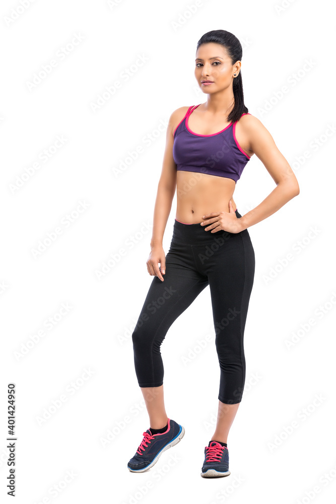 Attractive fitness woman in sport style posing isolated on white background. Attractive fitness woman in sport style posing isolated on white background.