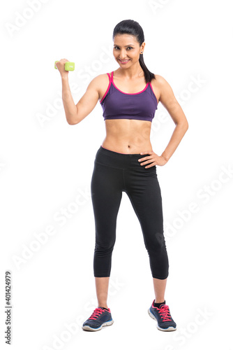 Healthy Indian woman with dumbbells working out on white background. fitness gym concept