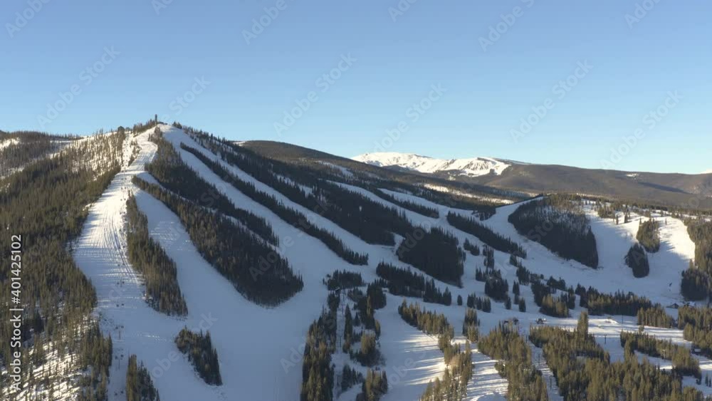 aerial panning shot of ski resort during the sunrise with a drone