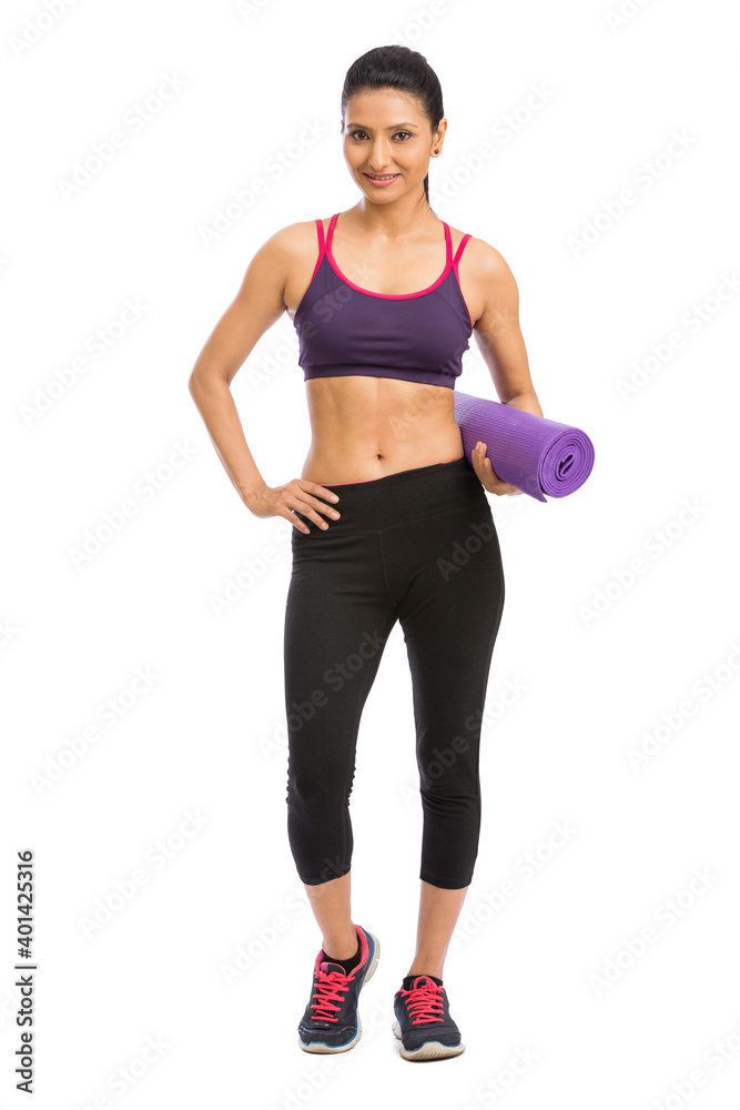 Young attractive woman holding a pink yoga mat. Isolated on white Young attractive woman holding a pink yoga mat. Isolated on white