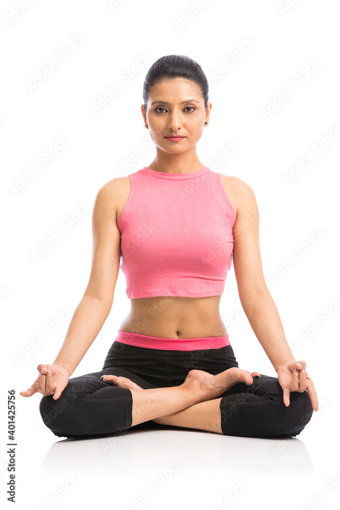 Beautiful young woman doing yoga isolated on white background.