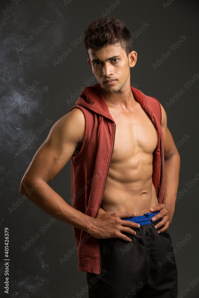 Fototapeta premium Young fitness man in studio shot