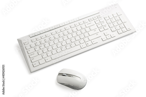 White wireless computer mouse and keyboard 