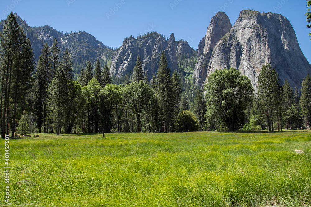 Amazing view of famous Yosemite Valley with rocks and river on a beautiful sunny day with blue sky in summer, Yosemite National Park, California, USA