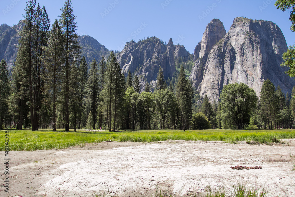 Amazing view of famous Yosemite Valley with rocks and river on a beautiful sunny day with blue sky in summer, Yosemite National Park, California, USA Amazing view of famous Yosemite Valley with rocks and river on a beautiful sunny day with blue sky in summer, Yosemite National Park, California, USA