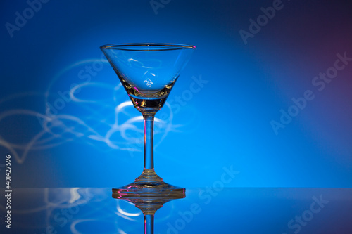 glass of wine on blue background