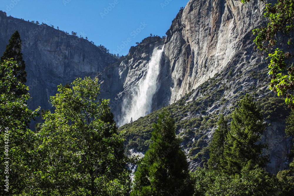 Amazing view of famous Yosemite Valley with rocks and river on a beautiful sunny day with blue sky in summer, Yosemite National Park, California, USA