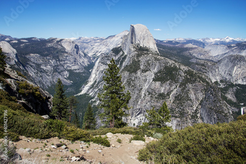 Amazing view of famous Yosemite Valley with rocks and river on a beautiful sunny day with blue sky in summer, Yosemite National Park, California, USA