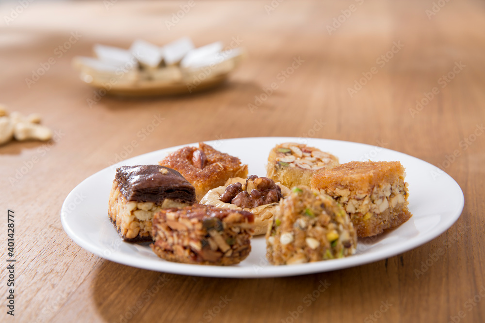 Plates of Oriental sweets on table. Plates of Oriental sweets on table.