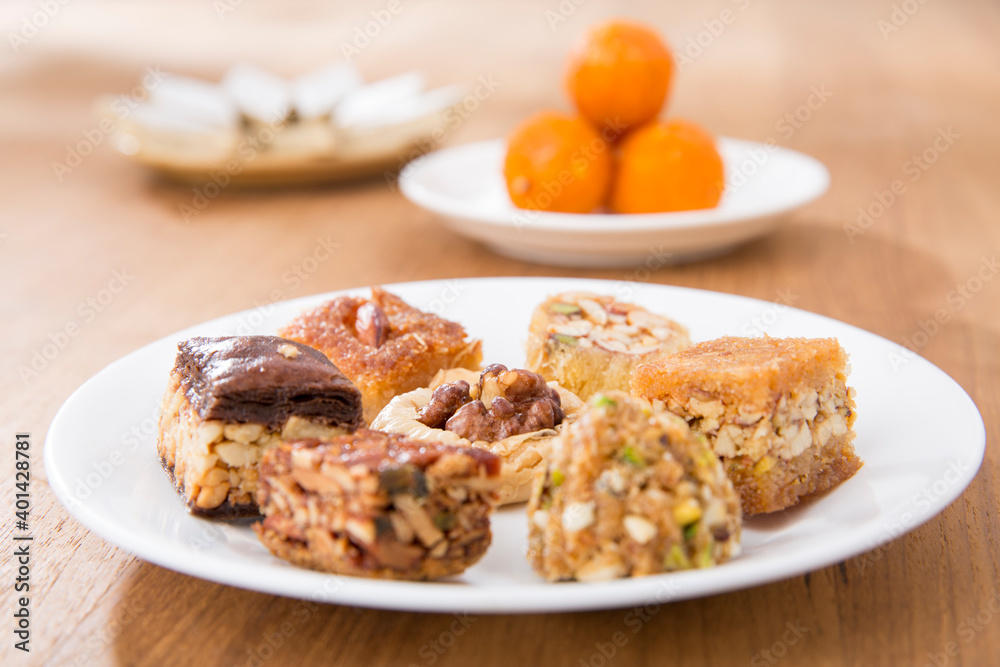 Plates of Oriental sweets on table. Plates of Oriental sweets on table.