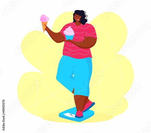 A young african american obese woman eating sweet junk food. A girl get on the scales to get rid of belly fat.