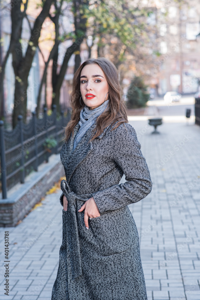Fototapeta premium Portrait of a beautiful and happy girl outdoors. Beauty and fashion