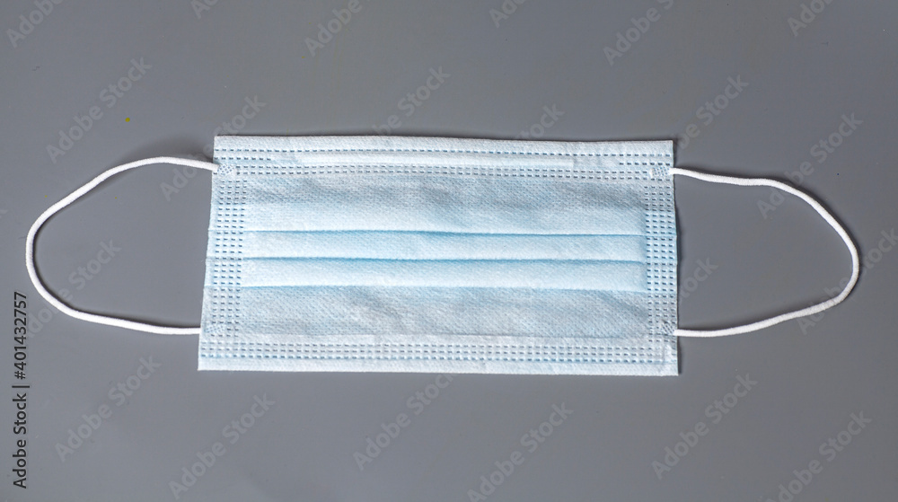Medical protective mask on grey background Medical protective mask on grey background