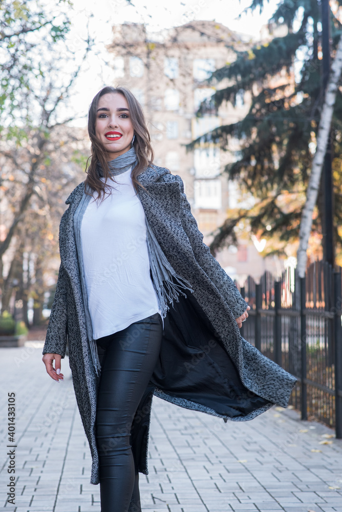 Portrait of a beautiful and happy girl outdoors. Beauty and fashion Portrait of a beautiful and happy girl outdoors. Beauty and fashion