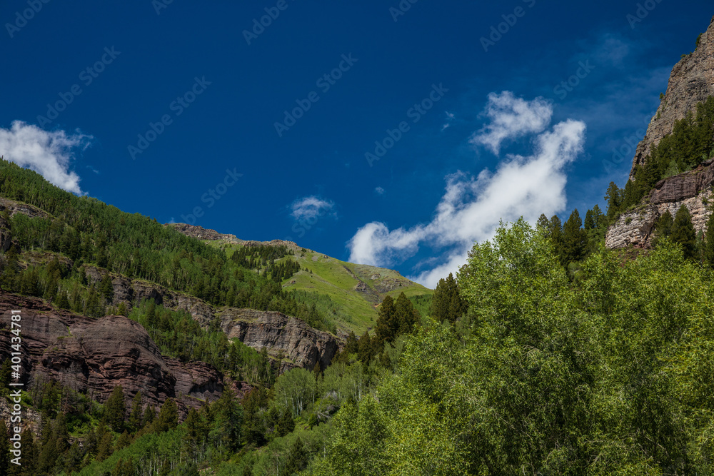 mountain landscape with blue sky and wispy clouds