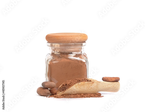 cocoa powder in glass jar and cocoa beans on white background