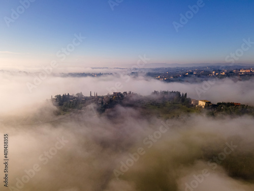 Misty morning in the countryside near Siena, Tuscany, Italy