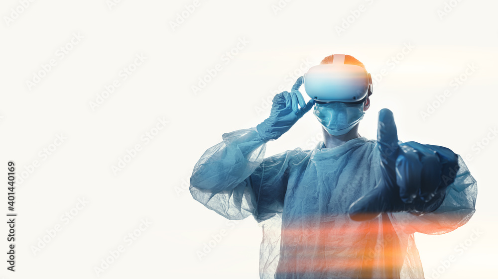 woman doctor in a helmet of viotual reality with manipulators in hands on a white background. the concept of conducting remote operations using modern VR technologies